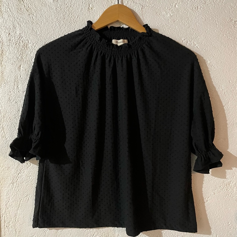 Madewell’s Texture & Thread Clip Dot Ruffle Top (Black)